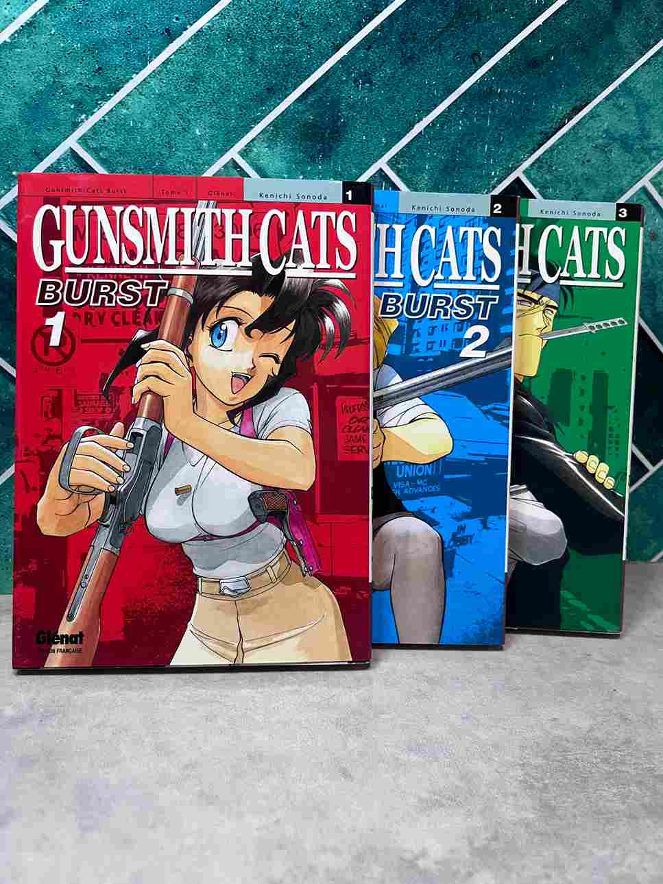 Minnie Mey et Rally Vincent reprennent du service ! Dans cette suite de Gunsmith Cats, les deux plus redoutables chasseuses de primes de Chicago repartent